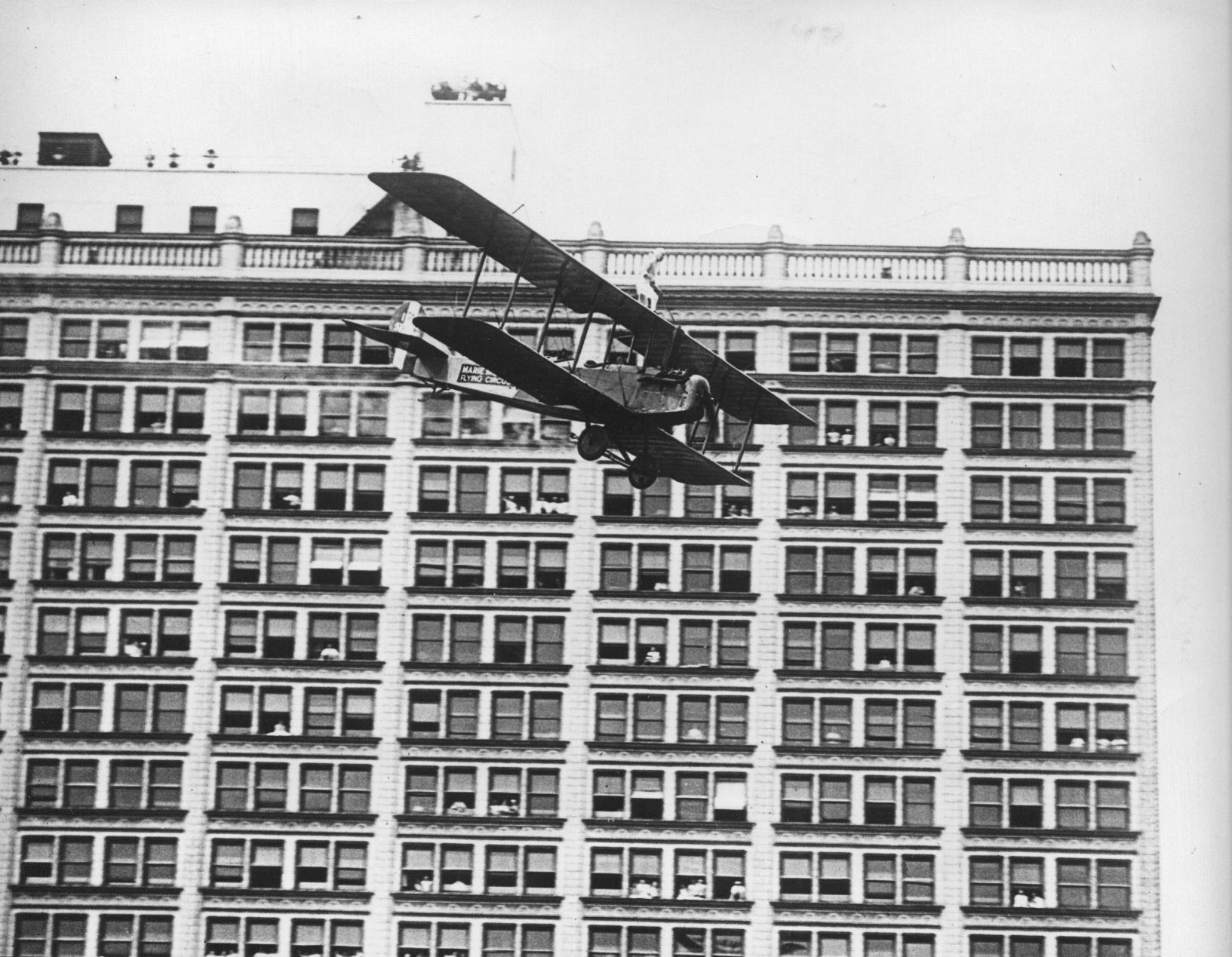 Plane flies past the Railway Exchange in 1928